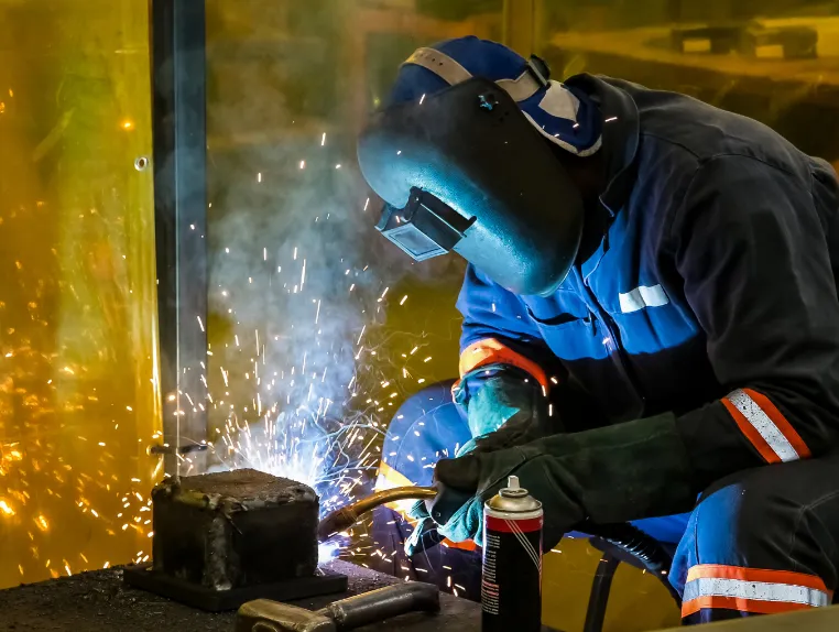 male working with welding torch